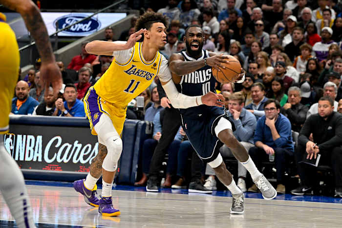 Mavs' Tim Hardaway Jr. drives to the basket past Lakers' Jaxson Hayes.